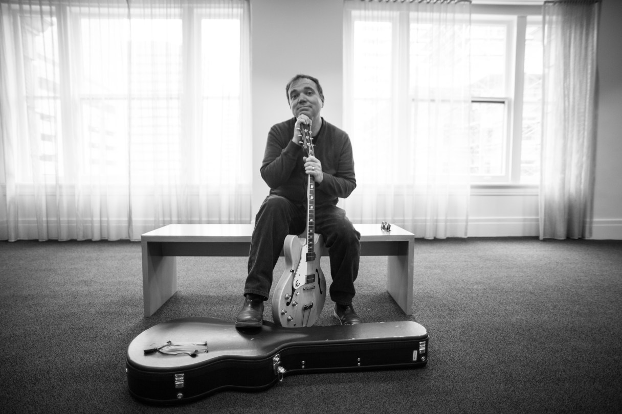 Scott Whiddon poses with a guitar