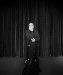 Scott Whiddon poses with guitar case